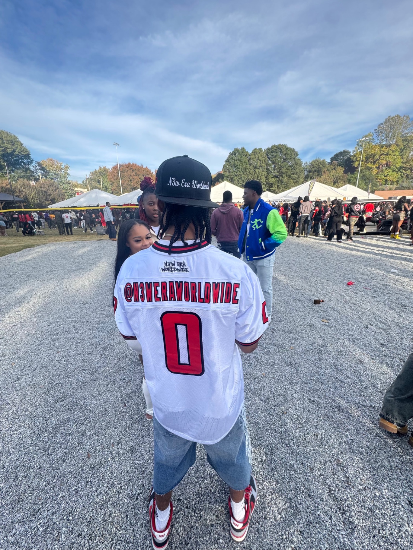 @N3WERAWORLDWIDE jersey at a homecoming tailgate