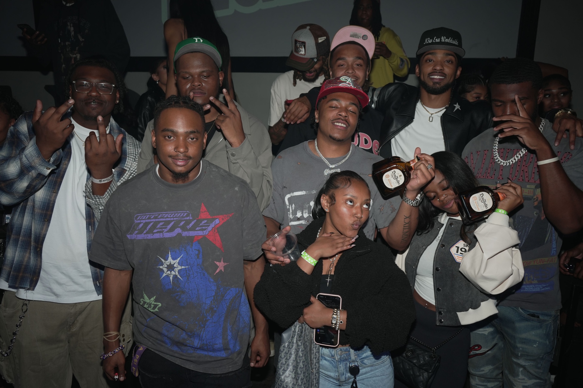 N3wera Worldwide crew and guests posing together at a nightlife event